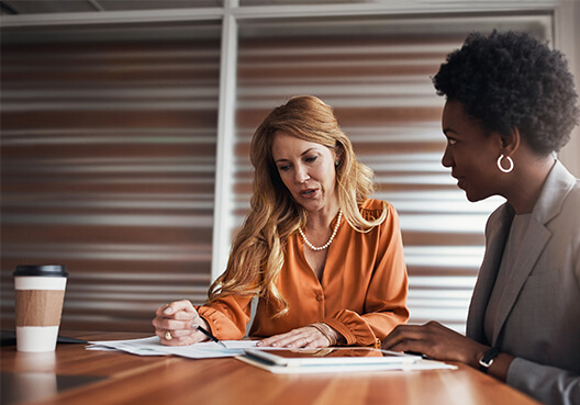 Two businesswomen talking to each other